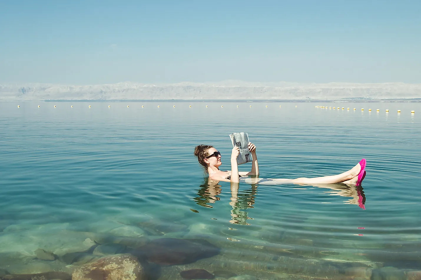Woman Swimming in the dead sea - Bloom Dead Sea